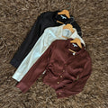 Blusa satinada botones dorados